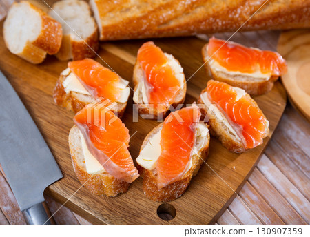 Salmon toasts with butter. Delicious lunch Salmon toasts with butter. Delicious lunch 130907359