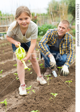 Father and daughter working in garden Father and daughter working in garden 130907832