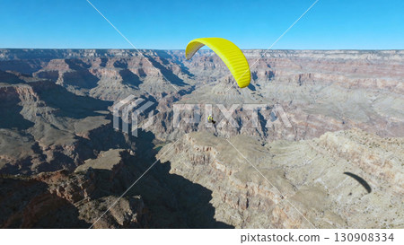 Paragliding Adventure Over Scenic Grand Canyon Landscape on Clear Day 130908334