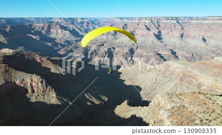 Paragliding Adventure Over Scenic Grand Canyon Landscape on Clear Day 130908335