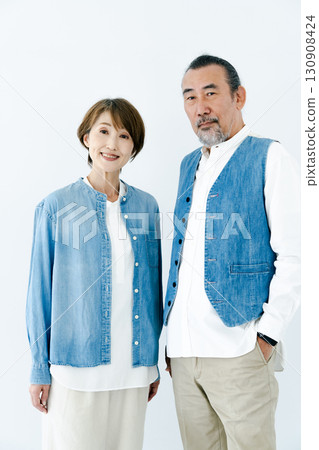 Portrait of a senior couple in matching outfits Portrait of a senior couple in matching outfits 130908424