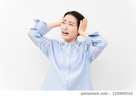 Woman wearing a long-sleeved shirt Woman wearing a long-sleeved shirt 130908583