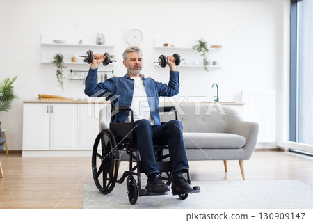 Mature Caucasian man in wheelchair lifting dumbbells during fitness activity at home, showcasing positivity, strength, and resilience. Bright and modern environment with natural lighting Mature Caucasian man in wheelchair lifting dumbbells during fitness activity at home, showcasing positivity, strength, and resilience. Bright and modern environment with natural lighting 130909147