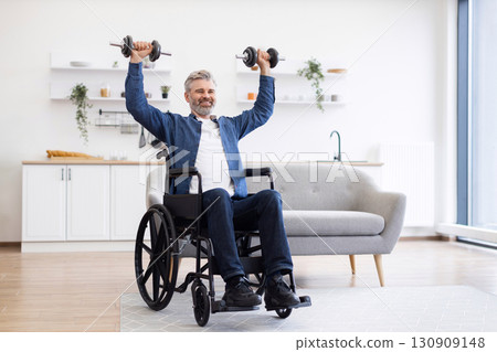 Mature Caucasian man in wheelchair lifting dumbbells during fitness activity at home, showcasing positivity, strength, and resilience. Bright and modern environment with natural lighting Mature Caucasian man in wheelchair lifting dumbbells during fitness activity at home, showcasing positivity, strength, and resilience. Bright and modern environment with natural lighting 130909148