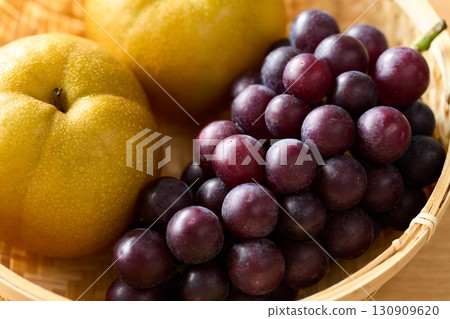 Grapes and pears in a basket Grapes and pears in a basket 130909620