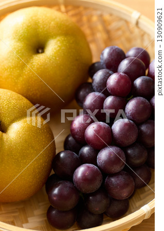 Grapes and pears in a basket Grapes and pears in a basket 130909621