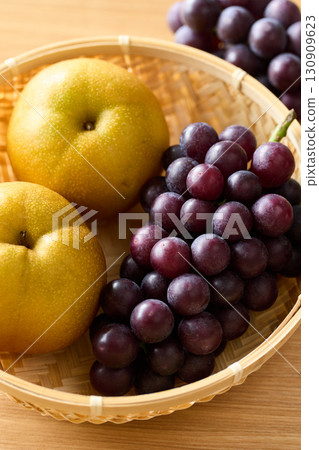 Grapes and pears in a basket 130909623