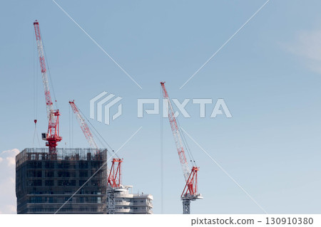 Crane at condominium construction site 130910380
