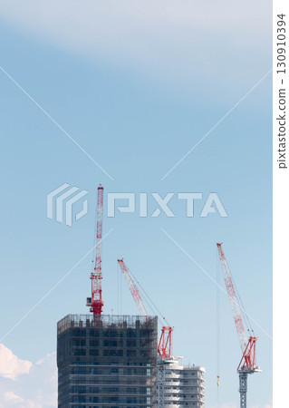 Crane at condominium construction site 130910394