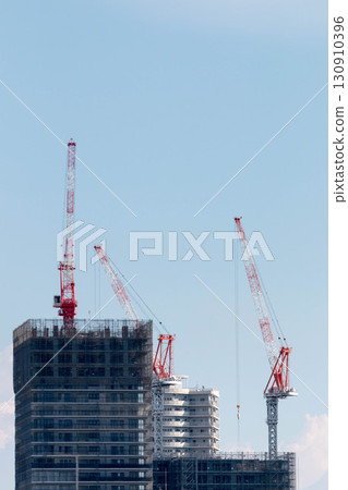 Crane at condominium construction site Crane at condominium construction site 130910396