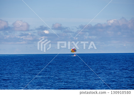 Parasailing and a towing boat. Kerama Islands, Shimajiri District, Okinawa Prefecture - June 27, 2025, Kerama Islands 130910580