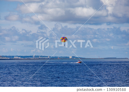 Parasailing and a towing boat. Kerama Islands, Shimajiri District, Okinawa Prefecture - June 27, 2025, Kerama Islands 130910588