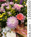 A colorful pink-based arrangement tied with a pink ribbon 130910600