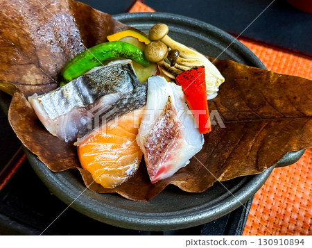 Sea bream, autumn salmon and blue fish grilled on a ceramic platter Sea bream, autumn salmon and blue fish grilled on a ceramic platter 130910894