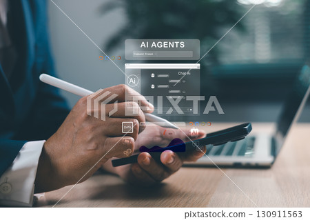 Businessman using smartphone with AI agents holographic interface. Artificial intelligence for chat, data analytics, automation and digital transformation in modern business solutions. Businessman using smartphone with AI agents holographic interface. Artificial intelligence for chat, data analytics, automation and digital transformation in modern business solutions. 130911563