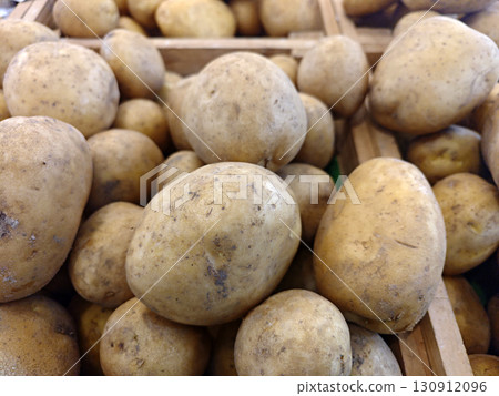 Fresh Golden Potatoes in Wooden Crate at Marketplace Display Fresh Golden Potatoes in Wooden Crate at Marketplace Display 130912096