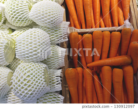 Fresh Vegetables Displayed in Market with Carrots and Cabbages 130912097