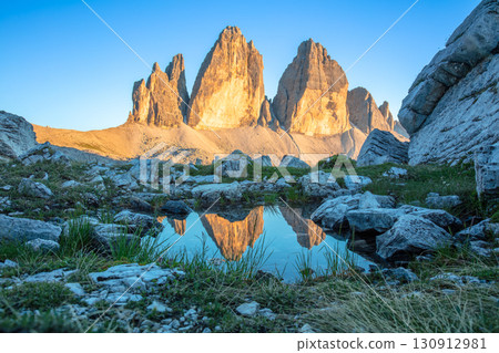 Tre Cime di Lavaredo and Reflection in a Small Pond Tre Cime di Lavaredo and Reflection in a Small Pond 130912981
