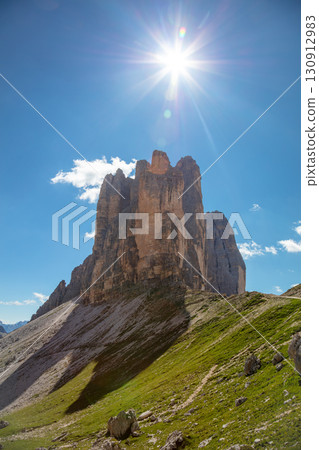 Bright Sun over the Peaks of Tre Cime di Lavaredo 130912983