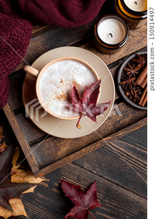 Cozy autumn composition with coffee, plaid and maple leaves Cozy autumn composition with coffee, plaid and maple leaves 130914497