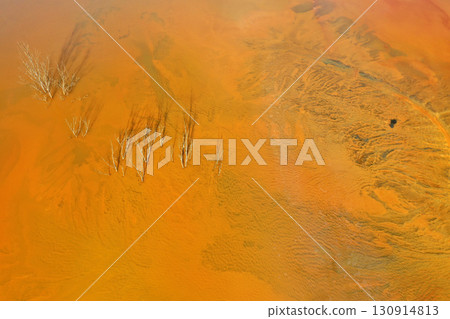 Aerial view of a big waste decanting lake, tailing pond. Mining residual waters discharged from copper mine 130914813