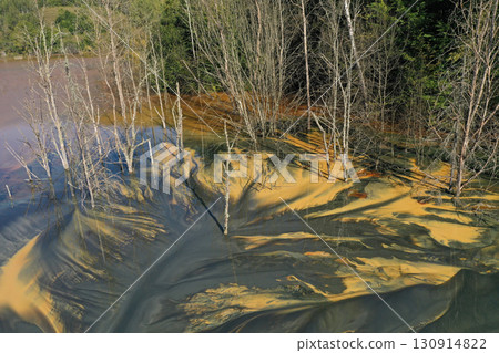 Aerial view of a big waste decanting lake, tailing pond. Mining residual waters discharged from copper mine 130914822
