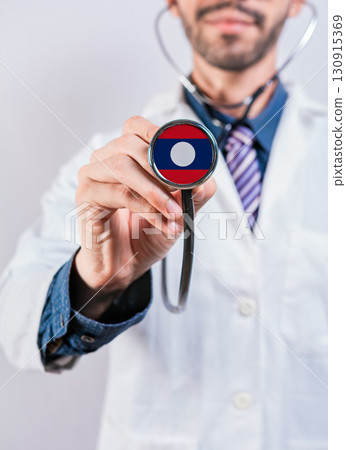 Laos health and medical insurance concept. Laos healthcare system, doctor holding stethoscope Laos health and medical insurance concept. Laos healthcare system, doctor holding stethoscope 130915369