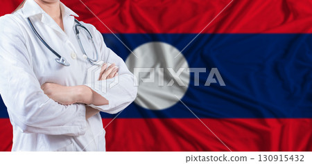 Doctor with crossed arms on Laos flag. Laotian health and care concept. Female doctor on Laos flag 130915432
