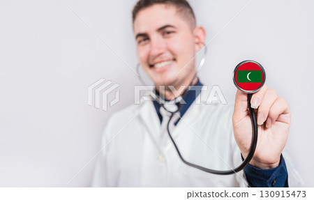 Doctor showing stethoscope with Maldives flag. Maldives national healthcare concept 130915473