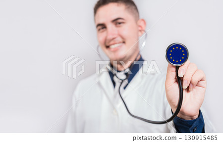 Doctor showing stethoscope with European Union flag. European Union national healthcare concept 130915485