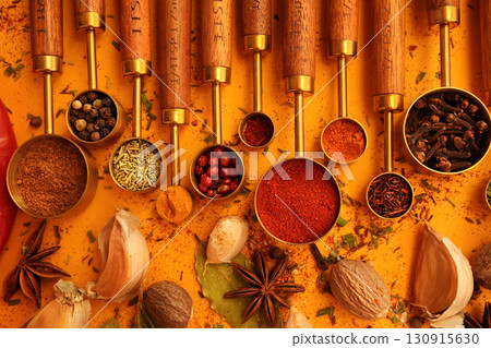 Colorful mix of herb and spice varieties: curry and coriander, turmeric and clove, paprika and pepper, cinnamon and garlic, cardamon and oregano Colorful mix of herb and spice varieties: curry and coriander, turmeric and clove, paprika and pepper, cinnamon and garlic, cardamon and oregano 130915630