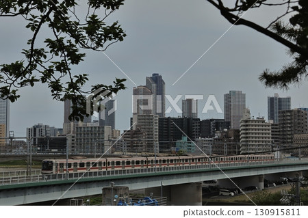 Tama River under cloudy skies and tower apartments in Musashi-Kosugi Tama River under cloudy skies and tower apartments in Musashi-Kosugi 130915811