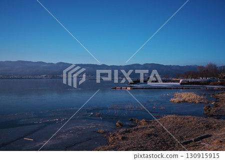 Lake Suwa in the dead of winter - Okaya Lakeside Park and Minato Nagisa Park overlooking frozen Lake Suwa Lake Suwa in the dead of winter - Okaya Lakeside Park and Minato Nagisa Park overlooking frozen Lake Suwa 130915915