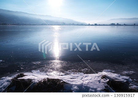 Lake Suwa in the dead of winter - Okaya Lakeside Park and Minato Nagisa Park overlooking frozen Lake Suwa Lake Suwa in the dead of winter - Okaya Lakeside Park and Minato Nagisa Park overlooking frozen Lake Suwa 130915917