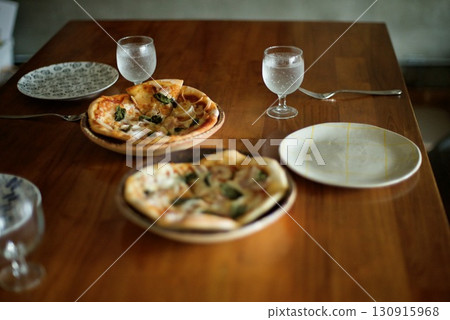 Homemade pizzas laid out on the table Homemade pizzas laid out on the table 130915968
