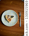 Just one slice of homemade pizza on a plate 130915969
