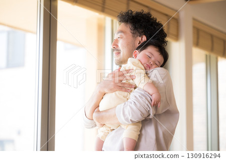 Dad putting baby to sleep 130916294