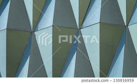 A blue and green building with a lot of triangles A blue and green building with a lot of triangles 130916959
