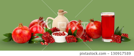Fresh pomegranates and vibrant juice create a colorful display 130917589