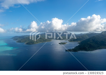 Aerial view of Tahaa island, French Polynesia, with turquoise lagoon and reef Aerial view of Tahaa island, French Polynesia, with turquoise lagoon and reef 130919323