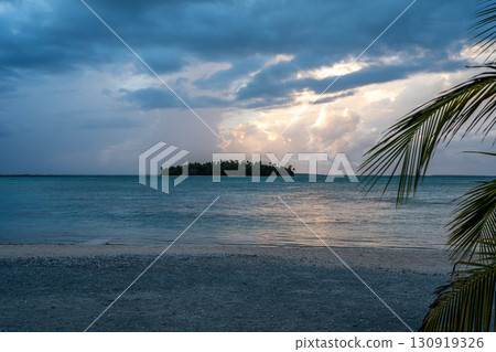 Sunset over a tropical motu on Tikehau Atoll, French Polynesia Sunset over a tropical motu on Tikehau Atoll, French Polynesia 130919326
