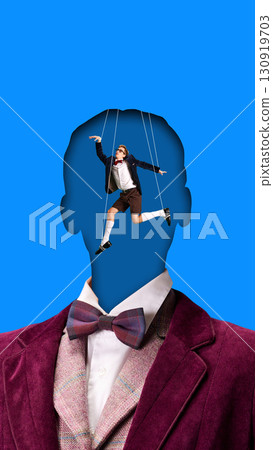 Contemporary composition. Surreal faceless man with puppet figure controlled by strings inside head Contemporary composition. Surreal faceless man with puppet figure controlled by strings inside head 130919703