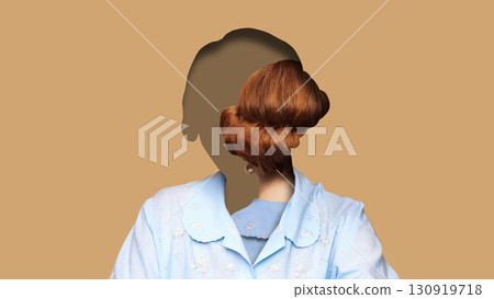 Creative digital artwork. Faceless woman with red hair bun inside silhouette on beige background 130919718