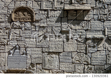 Poland, Krakow, Jewish Quarter of Krakow, Jewish tombstones forming a wall in the Remuh Synagogue cemetery 130920361
