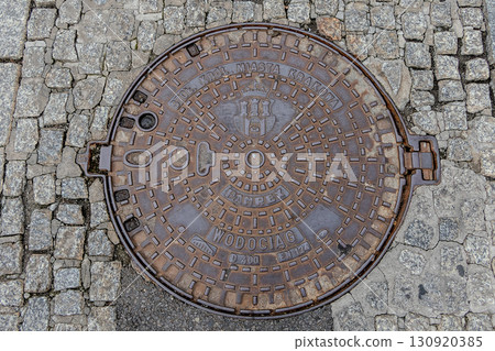 Poland, Krakow, Capital City Manhole Cover Poland, Krakow, Capital City Manhole Cover 130920385