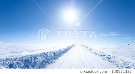 A simple landscape of Biei, Hokkaido in midwinter with blue skies and the winter sun 130921322