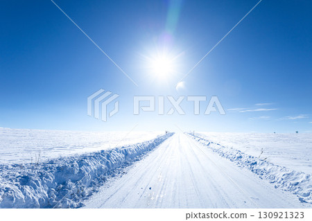 A simple landscape of Biei, Hokkaido in midwinter with blue skies and the winter sun 130921323