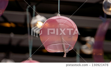 A scene with glass wind chimes welcoming the mixed role 130921478