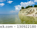Mount Pyvykha rises along the shore of the Kremenchuk Reservoir in Ukraine, resembling a massive rock and serving as a popular destination for camping, light hiking, and refreshing swims. 130922180