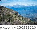 Hiking on trail along abandoned open-pit mine and burnt trees near Mijas, Spain  130922213